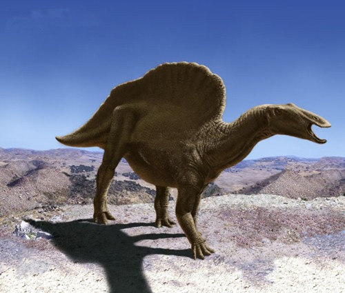 Reconstrução digital de Ouranosaurus nigeriensis em paisagem desértica, mostrando a vela dorsal proeminente sustentada por espinhos neurais alongados.